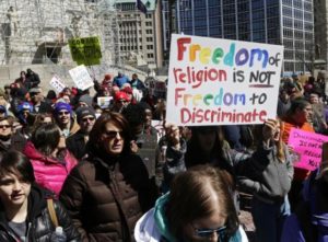 Demonstrators gather at Monument Circle to protest a controversial religious freedom bill recently signed by Governor Mike Pence during a rally in Indianapolis March 28, 2015. REUTERS/Nate Chute